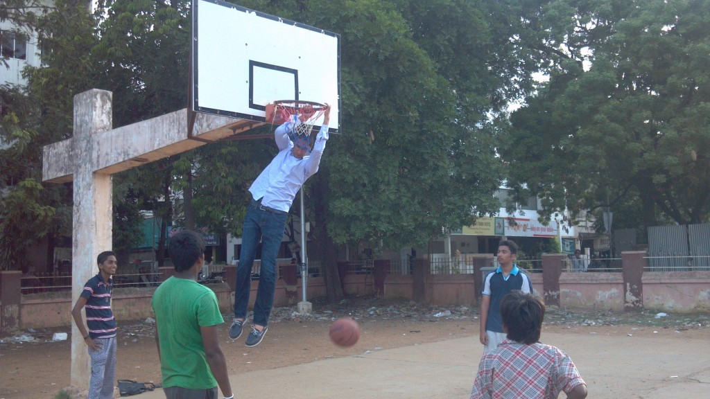 Eric catching an alley-oop from one of the kids at the park