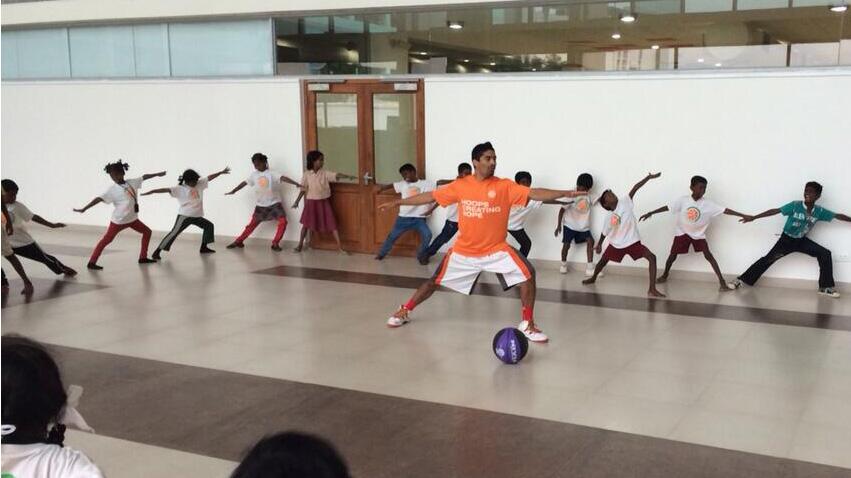 Varun doing his best to be like Lauren in doing yoga with the kids. 